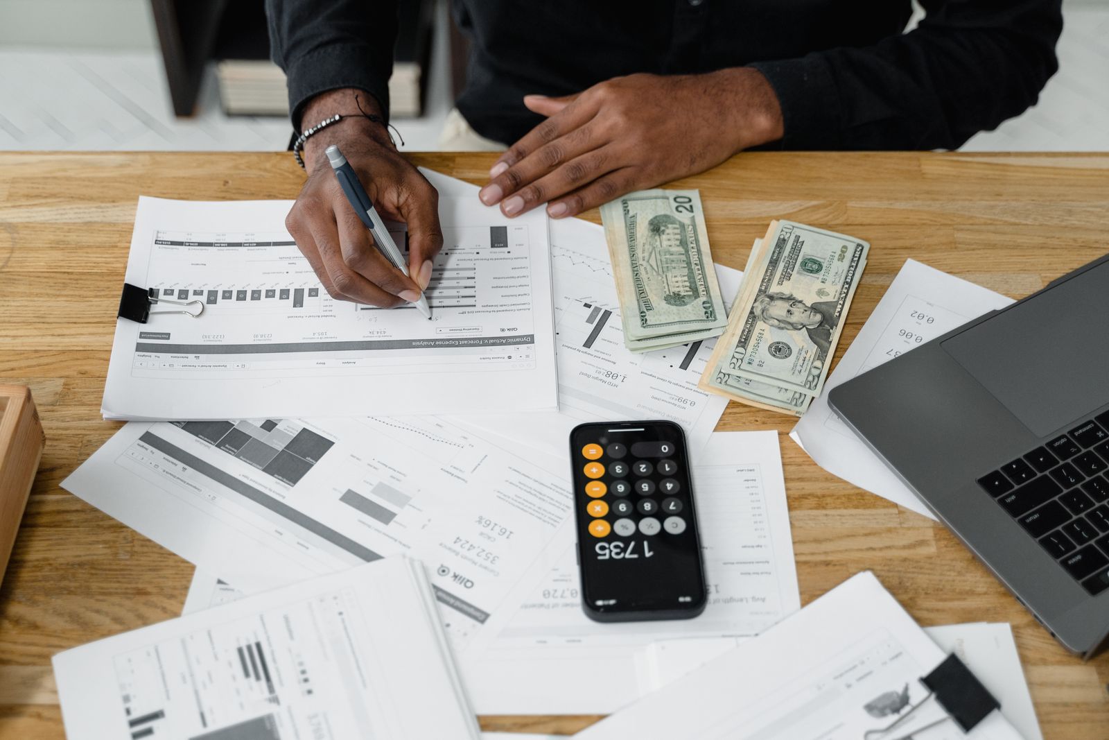 Accounting workspace with financial reports and calculator